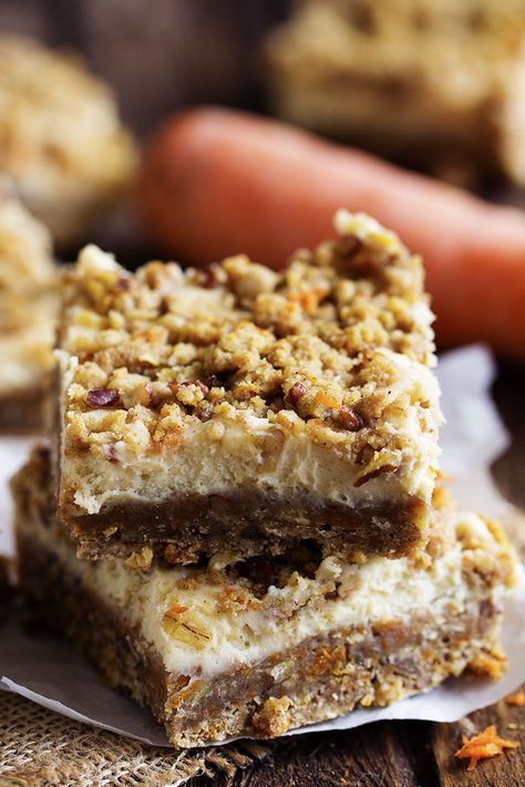 Crumbly spiced carrot cake bars with a delicious cheesecake center!  They are packed with flavor and sure to be a hit!  It is starting to feel like spring around here and we are loving it!  It was such a beautiful day today and it got into the 70s.  We spent most of our day outside … Carrot Cake Cheesecake Bars, Joni Lamb, Cheesecake Crumble, Carrot Desserts, Easy Toffee, Sweet Bars, Carrot Cake Bars, Easy Easter Desserts, Toffee Candy