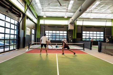 Pickleball, Yard Games, Live Music + More Indoor Pickleball Court Design, Indoor Pickle Ball Court, Home Pickleball Court Ideas, Indoor Pickleball Court Home, Indoor Pickleball Court, Chicken N Pickle, Indoor Pickleball, Rv Barn, Indoor Sports Court