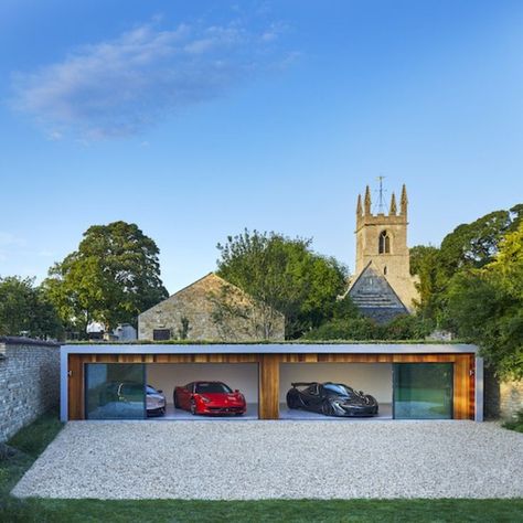 a wide single Storey home garage with sliding glass doors Large Sliding Glass Doors, House In England, Timber Garage, Garage Design Interior, 5 Car Garage, Dream House Aesthetic, Luxury Car Garage, Glass Garage Door, Carport Garage