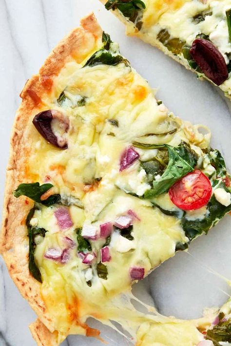 1.5M views · 3.6K reactions | High Protein Greek Breakfast Bake | High Protein Greek Breakfast Bake | By Food Dolls | Up your breakfast game with this high protein Greek quiche. Just take your tortilla, crack some eggs, add some cottage cheese, some tomatoes, olives, red onions, some spinach, mozzarella, and feta cheese because everything is better with feta. Bake it in the oven and you're golden. Yes. Greek Quiche, Eggs Casserole, Feta Bake, Wholesome Breakfast Ideas, Egg Casseroles, Spinach Mozzarella, Casserole Crockpot, Casseroles Recipes, Breakfast Tortilla