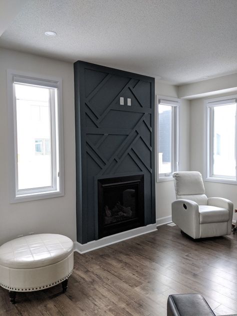 Wood paneling accent fireplace in Behr Blue Metal Diy Accent Wall With Fireplace, Wood Wall Art Blue, Black Wall Paneling Fireplace, Chimney Panelling, Wood Paneling Around Fireplace, Living Room Accent Fireplace Wall, Wood Design Fireplace Wall, Chimney Wall Panelling, Wood Trim Accent Wall Fireplace