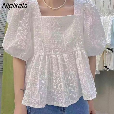 Pair a chic off-shoulder top with a flowing mini skirt and strappy sandals for a playful and fashionable summer look that’s perfect for warm weather. Cute Korean Tops, Korean Tops Outfits, Korean Tops Blouse, College Wear Outfits, Korean Tops For Women, Korean Clothing Brands, Square Form, Korean Blouse, Korean Top