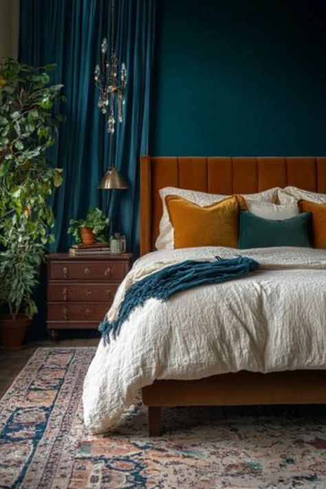 "Create a stunning interior with bold and moody color palettes! 🎨🖌️ Perfect for those who love deep, saturated hues in their decor. 🌟✨ #ColorInspiration #MoodyInteriors #HomeStyle" Moody Nature Bedroom, Muted Teal Bedroom, Jewel Tone Master Bedrooms Decor, Rust And Teal Bedroom, Blue And Burgundy Bedroom, Teal And Terracotta Bedroom, Moody Teal Bedroom, Jewel Tone Bedroom Ideas, Navy Copper Bedroom