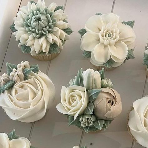 Crumbs! Custom Cupcakes🧁 on Instagram: "WEDDING CUPCAKES 🤍🌿🤍🌿  One of my favourite colour palettes: Sage green, latté and cream, such a classic, elegant feel and perfect for a wedding! I have included dahlias, rosettes, mini roses & peonies as well as magnolias. 🌿  #cupcakes #buttercreamflowers #weddingcupcakes #cupcakebouquet #milestonebirthday #wedding #cakeart #edibleflowers #buttercreamcupcakes ##floralcupcakes #cupcakesofinstagram #cupcakedesign #flowercupcakes #baking #capetownbaker#cupcakedecorating #customcupcakes #edibleart#cupcakelove #cakedecorating #capetown #bakinglove" Sage Wedding Cupcakes, Sage Wedding Cupcakes Ideas, Sage Green Cupcakes Wedding, Sage And Blush Cupcakes, Sage Cupcakes, Sage Green Cupcakes, Wedding Cupcakes Ideas Elegant, Sage Green Floral Cupcakes, Sage And Pink Cupcakes