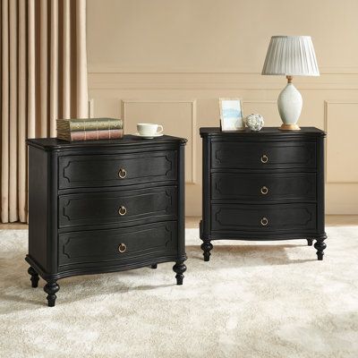 The nightstand set of 2 is crafted in a traditional style, featuring a curved front profile and solid wood spindle legs reminiscent of a bygone era. Plus, adjustable feet ensure stability on different surfaces while top and bottom boards with delicate moulded trims, add a touch of elegance to the piece. Antique bronze metal knobs adorn the drawers, enhancing the vintage appeal while providing easy access to the items within. Aesthetic appeal meets modern convenience with built-in power outlets, Colonial Nightstand, Black Antique Dresser, Bedroom Nightstand Ideas, Pearl Bedroom, Oversized Nightstand, Victorian Bedroom Furniture, Traditional Nightstand, Black Nightstands, Classic Bedside Tables