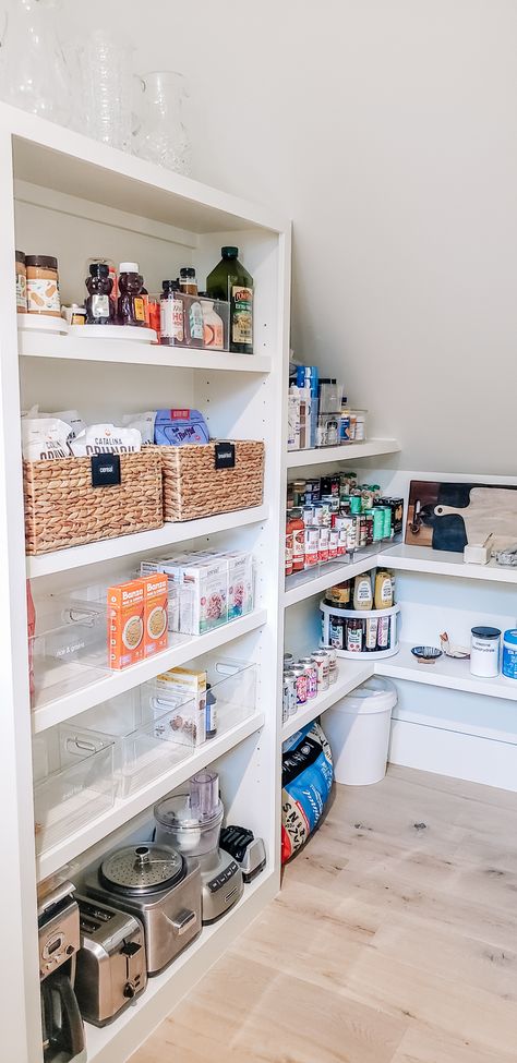 We love the challenge a different-shaped space brings us. In this pantry with a slanted ceiling, we were able to utilize every inch to its maximum potential! #organizing #organizingtips #organizingideas #homeorganizing #professionalorganizing #organizinginspiration #organizingsolutions #organizinggoals #organization #organizedlife #nashville #nashvilleorganizing #movingconcierge #unpacking #fyp #moveconcierge #unpackingnashville #kitchen #kitchengoals #kitchenorganization #kitcheninspo Slanted Ceiling Pantry, Understair Pantry Ideas, Beach House Pantry, Pantry Under Stairs, Stairs Pantry, Under Stairs Pantry, Walk In Pantry Ideas, Pantry Organization Hacks, House Pantry