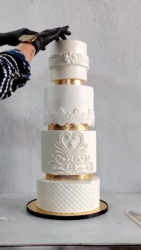 cakesbae on Instagram: White & Gold Wedding Cake ‼️😋 🎥 by @sugarfanciesbypooja #cakesbae #dessertbae #foodporn #bananabostoncreamcake #cakevideo… 4tier Wedding Cake, Coronation Cake, 5 Tier Cake, Gold And White Wedding Cake, Faux Wedding Cake, Scroll Wedding Cake, Modern Wedding Cake Designs, 4 Tier Cake, Classy Wedding Cakes