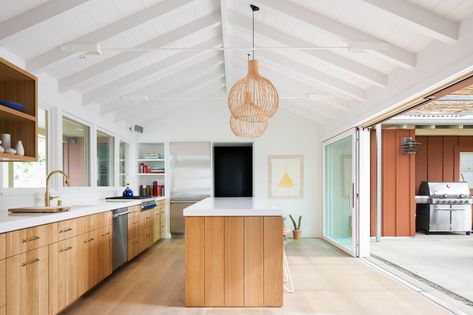 Continuum from interior to exterior. A 1950s California Ranch House Gets a Modern-Farmhouse Makeover - Dwell Kitchen Wood Counter, California Ranch House, 1950s California, Ceiling Makeover, Vaulted Ceiling Kitchen, Ranch House Remodel, California Ranch, Ranch Remodel, California Modern