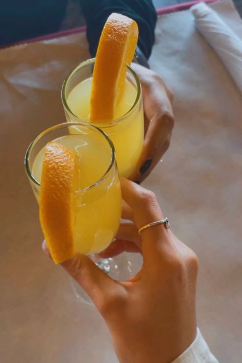 mimosas, brunch bev, orange slice garnish, toast, orange juice, champagne Brunch Mimosas Aesthetic, Mimosa Without Orange Juice, Brunch Pictures Instagram Mimosa, Champagne And Orange Juice, Orange Juice And Champagne Mimosas, Mimosas Brunch, Orange Slice, Orange Slices, Sunday Brunch