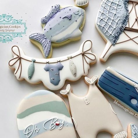 Deepshikha Pareek on Instagram: "First day of summer break and no morning chaos! Bonus…I got to have my coffee without heating it up a million times 😂  Since you all voted that I post the set first, so here’s the full set of this adorable fishing themed baby shower. When I got a request for this, I wasn’t sure what I’d do and was nervous. But I’m happy to see how these turned out.   My favorite is the baby crib and I loved the fish net touch. Which one is yours?🐠🐟🤍  Shiplap plaque inspo @hartworkcookieco   #babyshowercookies #babyshower #decoratedcookies #decoratedsugarcookies #royalicingcookies #cookiedecorating #cookiedecorator #royalicing #baby #babyboy #fishingcookies #fishing #cookies #grandrapids #grandrapidscookies #michigan #foodstyling #foodphotography #sugarcookiemarketing #f Fishing Themed Baby Shower, Fishing Cookies, Fishing Baby Shower Theme, Baby Shower Fishing, Fish Cookies, Baby Fish, First Day Of Summer, Baby Cookies, Fish Net