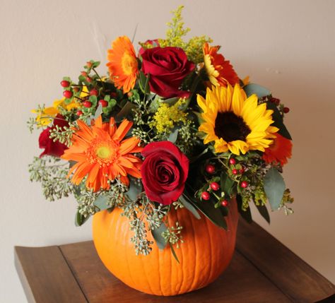 pumpkin and flower centerpieces | Our gorgeous new portfolio book just appeared and we cannot stop ... Pumpkin Bouquet, Fall Flower Arrangements, Fall Floral Arrangements, Pumpkin Flower, Fall Arrangements, Pumpkin Centerpieces, Fall Wedding Flowers, Deco Floral, Fall Centerpiece