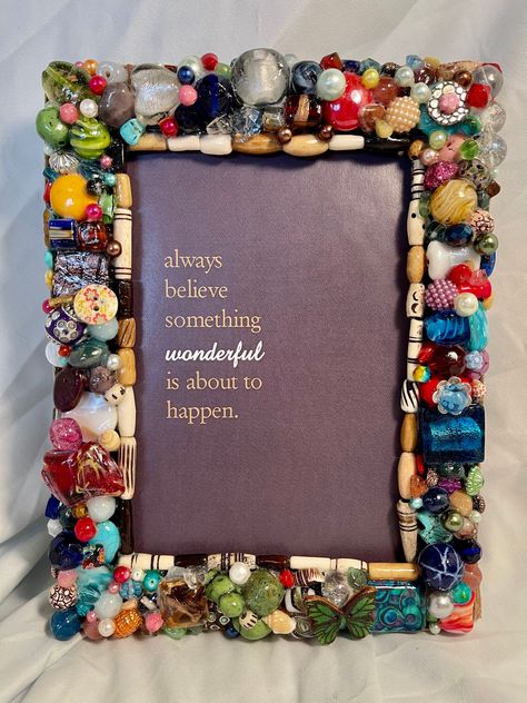 "This gorgeous hand beaded photo frame will fit your favorite 5\"x 7\" photo. Each bead is thoughtfully placed by hand, then all is sealed in a waterproof, pearly glaze. Clean with a damp cloth. Edged in ribbon, with an easel back for tabletop use , and hooks for hanging. Total frame is 8\" x 6-1/2\"  I use an eclectic mix of beads in all my work, including Czech glass, Swarovski crystals, resin, acrylic, faux pearls, mixed metal, semi-precious stones, polished stones, polished glass, Murano gla Kids Picture Frames, Old Jewelry Crafts, Resin Acrylic, Diy Picture Frames, Craft Day, Repurposed Jewelry, Button Art, Frame Crafts, Button Crafts