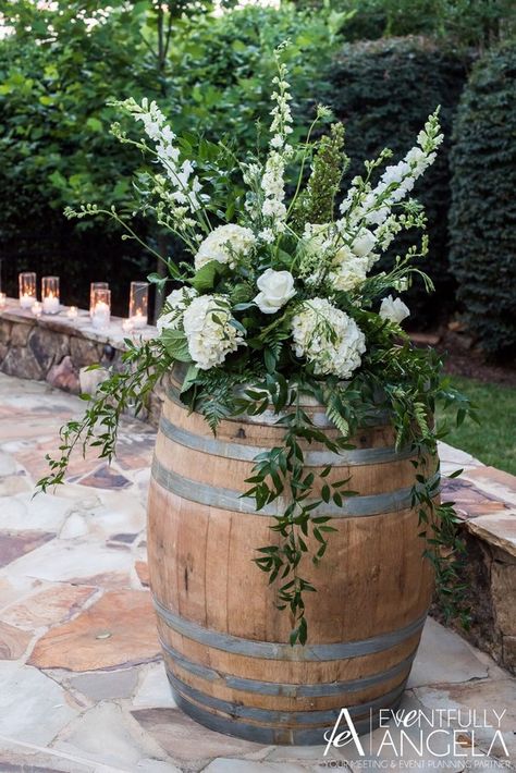 Rustic weddings are quite trendy these days. Among all the decorations, wine barrels are definitely one of a kind. They are visually appealing and the vintage Wine Barrel Wedding Ideas, Wine Barrel Flower Arrangements, Wine Barrel Wedding Flowers, Wine Barrel Wedding Decor, Barrel Wedding Decor, Wine Barrel Wedding, Barrel Flowers, Whiskey Barrel Wedding, Jordan Wedding