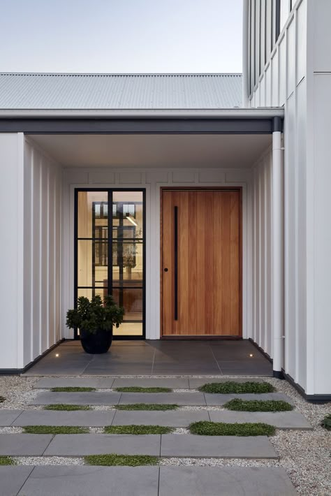 Pivot timber entry door and board and batten cladding at the Village House by GLOW design group Glow Design, Front Door Styles, Modern Entrance Door, Modern Exterior Doors, House Entry, House Village, Modern Entrance, Modern Front Door, Entrance Door Design