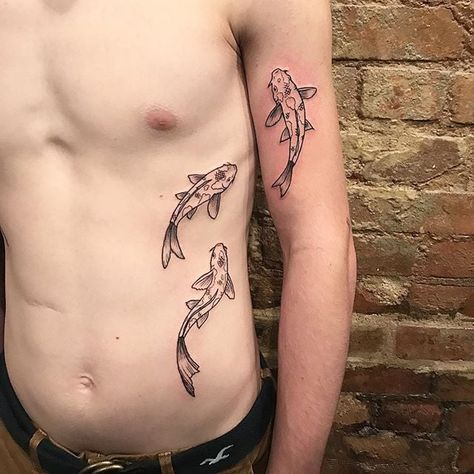 These 25 Koi Fish Tattoos Ideas Will Swim Into Your Heart Koi Fish Tattoo On Stomach, Fish Band Tattoo, Choi Fish Tattoo, Swimming Fish Tattoo, Koi Fish Stomach Tattoo, Three Fish Tattoo, Fish Swimming Tattoo, Koi Fish Tattoo Traditional, Traditional Koi Fish Tattoo