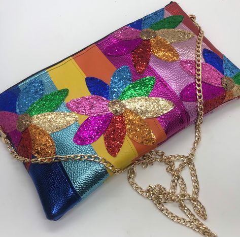 Rainbow metallic stripe bag.  💛 Made from stripes of different colours of metallic faux leather fabric.  💖 Choose the size of bag that you would like from the drop down list. The size options are: Extra small will be approx 21 by 15cms Small will be approx 24 by 17cms Medium will be approx 27 by 18cms Large will be approx 30 by 19cms 💕 The front of the bag, will be embellished with multi colour glitter daisies.  💛 Choose whether to have the bag as a clutch bag (no chain or loops) or for it t Colour Stripes, Rainbow Daisy, Colour Flowers, Daisy Bags, Glitter Purse, Rainbow Colour, Rainbow Bag, Glitter Flowers, Striped Bags