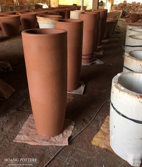 A lot of rustic tall tapered round terracotta planters in ochre colors at Hoang Pottery's factory.  Website: www.hoangpottery.com  #hoangpottery #terracottaplanters #terracottapots #gardendecoration #decor #outdoordecoration #decoration Tall Terracotta Pots, Tall Terracotta Planters, Arizona Decor, Wall Art Decor Prints, Terracotta Planter, Decor Prints, Plant Pots, Terracotta Pots, Gardening Ideas