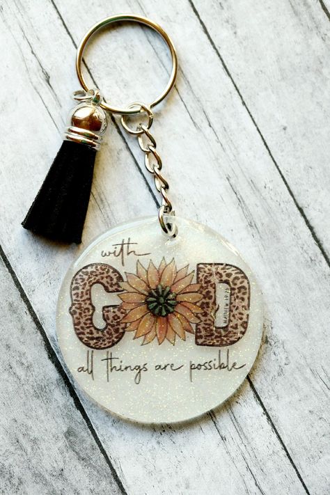 "Christian Acrylic keychains are the perfect addition to show your faith on your keys, backpack, purse etc!  \"...With GOD all things are possible.\" Matthew 19:26  These make great stocking stuffers or gifts for friends and teachers!  All keychains are handmade using a 1/8 inch acrylic base, hand glittered with extra fine or chunky glitter on the back with decal on the front and sealed with UV Resin. ITEM DETAILS: * 2 inch acrylic disc * UV Resin * Glitter CUSTOM ORDERS: Please let me know if y Acrylic Keychains With Uv Resin, Keychain Sayings, Cricut Personalized Gifts, Cricut Personalized, Cricut Keychains, Custom Key Chains, Laser Crafts, Diy Keychains, Tumbler Making