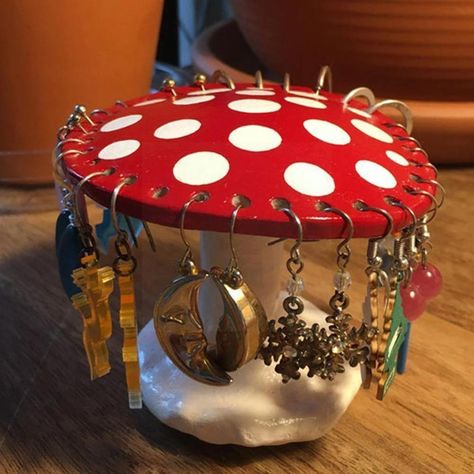 This red amanita mushroom earring holder is a stylish way to keep your earrings and pendants organised and also a eye catching piece of decor perfect for fairycore/cottagecore aesthetic lovers. Package includes: 1x Mushroom Earring Holder Size: ~3.15x3.7in (~9.5x7.5cm), 26 holes Material: Polymer Clay Mushroom Earring Holder, Mushroom Earring, Jewelry Display Organizer, Mushroom Jewelry, Earring Display Stands, Earring Storage, Jewelry Rack, Jewelry Display Stands, Earring Organizer