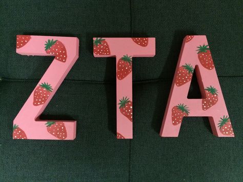 Kd Letters Painted, Sorority Letter Painting Ideas, Cute Sorority Letters Painted, Greek Letters Painted Sorority, Zta Letters Painted, Zta Canvas Painting, Pink Sorority Letters, Sorority Letter Ideas, Strawberry Sorority