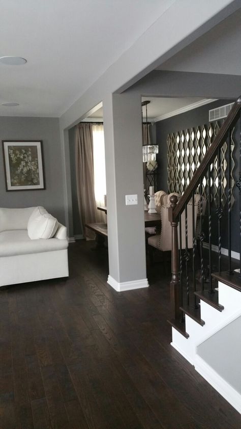 Gray walls and dark wood floors. Dark Wood Floors And Grey Walls, Dark Wood Floor Grey Walls, Dark Wood With Grey Walls, Gray Walls With Hardwood Floors, Gray And Dark Wood Living Room, Grey Walls With Dark Wood Floors, Brown Wood Floors With Gray Walls, Floor For Grey Walls, Grey Wood Stain Floors