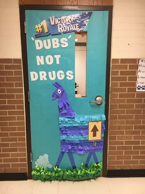 This year we went with a Fortnite theme for our Red Ribbon Week door decor. We used a Llama from the game with the tag line “Dubs Not Drugs”. We added the Victory Royale logo at the top. Red Ribbon Week Door Decorating Middle School, Red Ribbon Week Door Decorating Contest, Red Ribbon Week Door, Counselors Office, School Restroom, Classroom Decor Middle, Victory Royale, School Volunteer, Classroom Decor High School