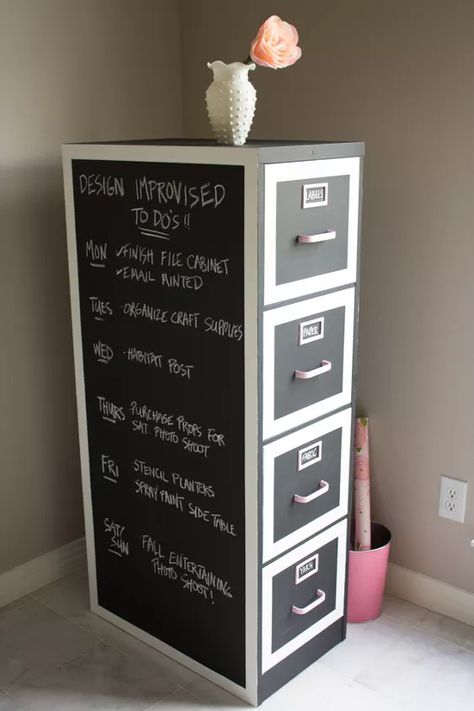 Transform an old file cabinet into chic craft supply storage with built-in calendar thanks to chalkboard paint! The entire file cabinet was covered in a few coats of black chalkboard paint, making it a blank canvas for writing down to do's, labeling the drawers, etc. Thick white borders and light pink hardware add a modern, feminine touch to the cabinet. The deep drawers of a file cabinet are perfect for storing bulky craft items like yarn! Here's the original file cabinet. I l… Painted File Cabinets, Craft Closet Organization, File Cabinet Makeover, Black Chalkboard Paint, Large Chalkboard, Craft Supply Storage, Arts And Crafts Storage, Chalkboard Decal, Dining Room Hutch