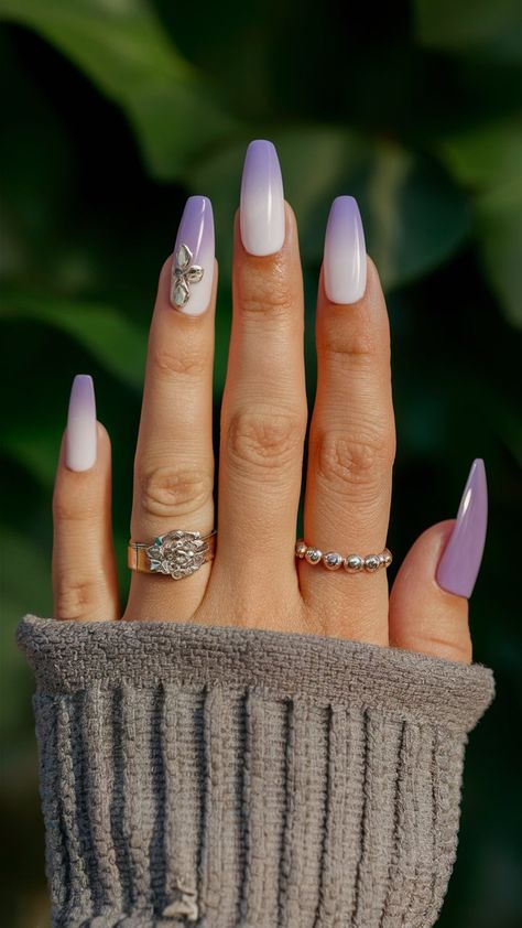 -Embrace tranquility with this stunning lavender ombre nail design! The soft gradient blends shades of lavender into a delicate finish, creating a calming and chic look. Perfect for springtime or any occasion that calls for a splash of color, these nails exude elegance and creativity. Pair them with pastel outfits for a fresh, harmonious vibe! 💜✨ #OmbreNails #LavenderNails #NailArtInspiration Lavender Ombré Nails, Lavender White Ombre Nails, Lilac Ombré Nails, Lavender Ombre Nails Almond, Ombre Nails Purple Lavender, Ombre Nails Lilac To White, Silver Ombre, Lavender Nails, Ombre Nail Designs