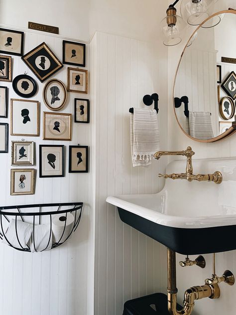 Black white and brass bathroom with antique silhouette art gallery wall kellyelko.com Eclectic Black And White Bathroom, Antique Bathroom Wall Decor, French Bathroom Black And White, Master Bathrooms Vintage, Black And White Antique Bathroom, Black And White Cottage Bathroom, Vintage Bathroom Photos, Eclectic Black And White Decor, Bathroom Art Gallery Wall