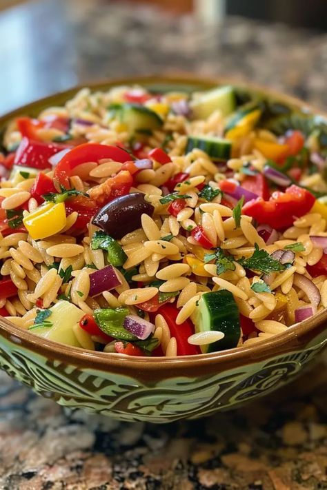 Looking for a refreshing and healthy dish that’s super easy to whip up? Check out this Mediterranean Orzo Salad! With vibrant veggies, zesty olives, and perfectly cooked orzo pasta, it makes a perfect light lunch or side dish. Ideal for picnics or quick weeknight dinners, this yummy salad is loaded with flavor thanks to a sprinkle of feta and a drizzle of olive oil. Plus, it can be easily made ahead of time for those busy days. Dive into this healthy Mediterranean delight today! Orzo Spinach Salad Recipes, Orzo Feta Salad, Orzo Spinach, Mediterranean Orzo Salad, Mediterranean Orzo, Greek Orzo Salad, Type Of Pasta, How To Cook Orzo, Spinach Salad Recipes