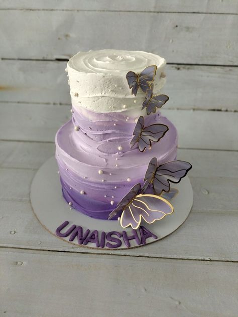 Perfect layers of Purple shade for a beautiful angel decorated with butterflies and topped with white chocolate mousse swirl ... White Cake With Purple Butterflies, Two Layer Butterfly Cake, Lilac Cake With Butterflies, 2 Layer Butterfly Cake, Purple Layer Cake, Double Layer Cake Designs Birthday, Two Tier Birthday Cake For Women Elegant, Purple Cake Decorating Ideas, Birthday Cake Double Layer