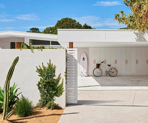 A Victorian couple got the modern mid-century look they were after by adding a little Scandinavian style to their beach home. Mid Century Beach House, Modern Carport, Mid Century Modern Exterior, Mid Century Exterior, Palm Springs Style, Beach House Exterior, Carport Designs, Modern Garage, Modern Beach House