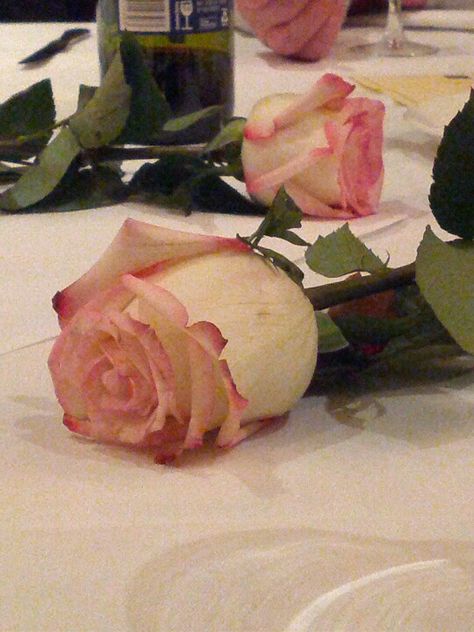 Spread fresh roses on table  as your table decorations Flower Laying On Table, Flowers Laying On Table, Roses On Table, 21st Birthday Party Ideas, Aesthetic Doodles, Wilted Rose, Ap Portfolio, Marriage Celebrant, Bistro Tables