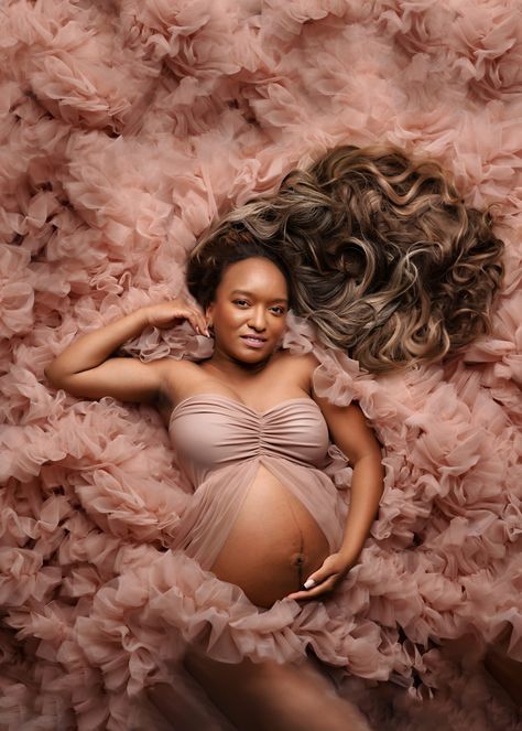 pregnant mom laying in pink tulle gown with dark hair flowing Solo Maternity Pictures, Sleeping Poses, Floor Poses, Pink Tulle Gown, Bump Shoot, Sleeping Pose, Hair Flowing, Family Maternity Photos, Studio Maternity