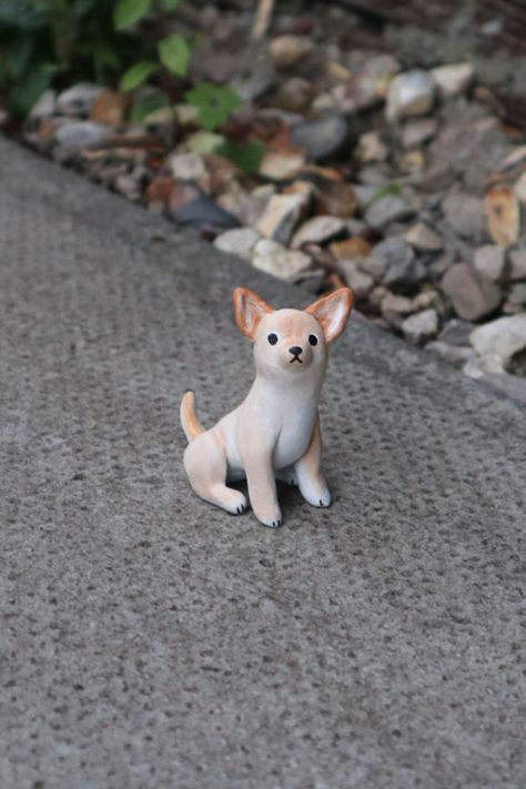 A miniature Chihuahua made from clay, photographed outside on stone paving. It is sitting up with a slightly concerned, wide-eyed expression. Miniature Chihuahua, Dog Pottery, Clay Birds, No Coffee, Instagram Drawing, Wood Carving Patterns, Dog Sculpture, Wood Burning Art, Clay Animals