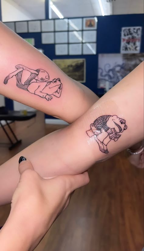 Tattoos Two People, Frog And Toad Matching Tattoo, Frog And Toad Tattoos, Max And Ruby Tattoo, Twinning Tattoos, Matching Frog Tattoos, Toad Tattoos, Frog And Toad Tattoo, Coordinating Tattoos