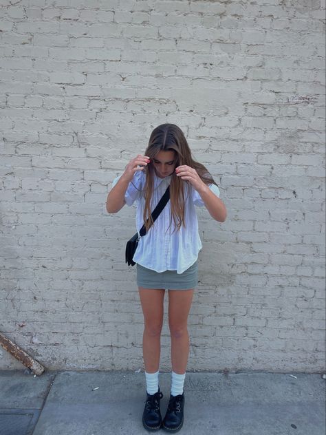 girl in dr martens, green cargo mini skirt and white ruffle shirt posing in front of white brick wall Brick Wall Poses Photo Shoot, Brick Wall Photoshoot Ideas, Brick Wall Photoshoot, Black Brick Wall, White Brick Wall, Downtown Aesthetic, Aesthetic Fit, Black Brick, Aesthetic Fits