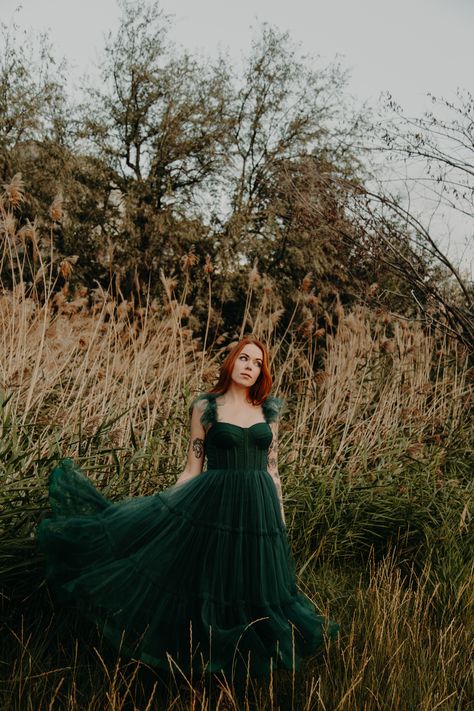 ava gowns mia dress in forest green, photography by @whitneyalysonjpg Formal Dress In Field, Emerald Dress Photoshoot, Dress In Forest Photoshoot, Green Dress Photoshoot, Red Hair Green Dress, Enchanted Forest Photoshoot, Forest Green Gown, Ava Gowns, Dark Green Gown