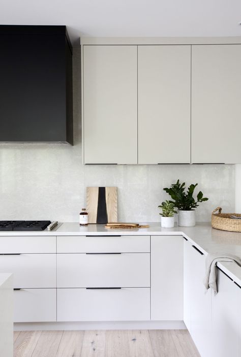 Whistler Residence - PURE Design by Ami McKay Modern White Kitchen Black Hardware, Modern Coloured Kitchen, Off White Kitchen Black Handles, White Flat Kitchen Cabinet Doors, 2 Colour Kitchen Cabinets Modern, Modern Off White Kitchen, White Kitchen Drawer Pulls, White Kitchen With Black Hardware Modern, Kitchen Cabinet Pulls Black