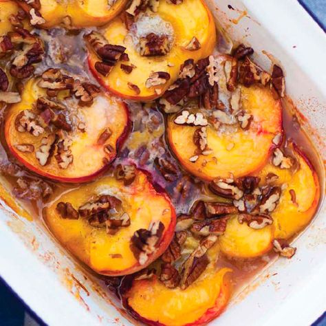 Roasted Peaches With Honey And Pecans | Dessert Recipes | Woman&home Roasted Nectarines, Pecan Desserts Recipes, British Summertime, Baked Peaches, Roasted Peaches, Nectarine Recipes, Caramelized Peaches, Pecan Desserts, Quintessentially British