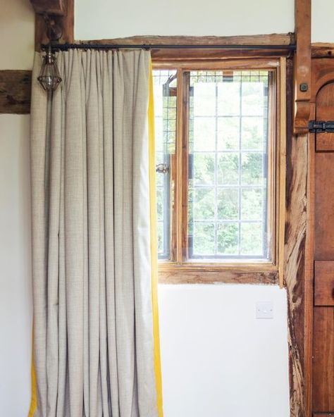 Tor Interiors on Instagram: "The art of keeping it simple 🤍 When a space is as naturally beautiful as our barn restoration project, it’s important to compliment its beauty, rather than overpower it ✨ The wool feel fabric of these @chatsworthfabrics curtains is the perfect partner to the wooden beams and window frame. I love how the yellow border adds a pop of colour too! 👏 Metal curtain poles @jimlawrencemade" Barn Restoration, Wooden Beam, Metal Curtain Pole, Yellow Border, Curtain Pole, Metal Curtain, Keeping It Simple, Perfect Partner, Wooden Beams