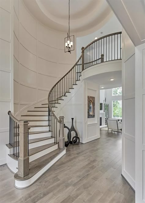 Light flows through entire foyer Interior Stairs Ideas Staircases, Curved Staircase Lighting, Large Open Staircase, Second Story Hallway Ideas, Grand Foyer Staircase, Big Staircase Grand Entrance, Curved Stair Railing Ideas, Round Staircase Railing Design, Unique Staircase Railing