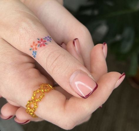 Color Tiny Tattoo, Unique Rainbow Tattoo, Colorful Dainty Tattoos, Colorful Wrist Tattoos, Tiny Color Tattoos, Cute Color Tattoos, Colorful Hand Tattoos, Flower Ring Tattoo, Finger Flower Tattoo