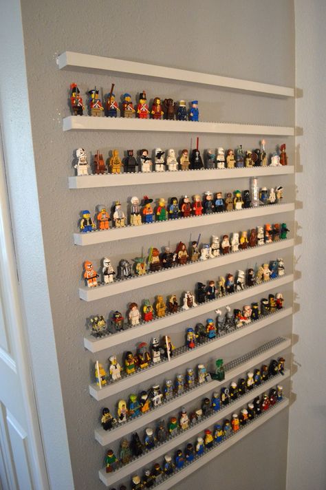 Very cool!!! However, it would probably be easier and safer for the wall to create the shelving as one piece vs individual shelves as it appears here.                           * think smarter, not harder * Lego Storage Ideas, Lego Minifigure Display, Lego Bedroom, Lego Organization, Lego Table, Lego Display, Lego Room, Lego Storage, Lego Minifigure