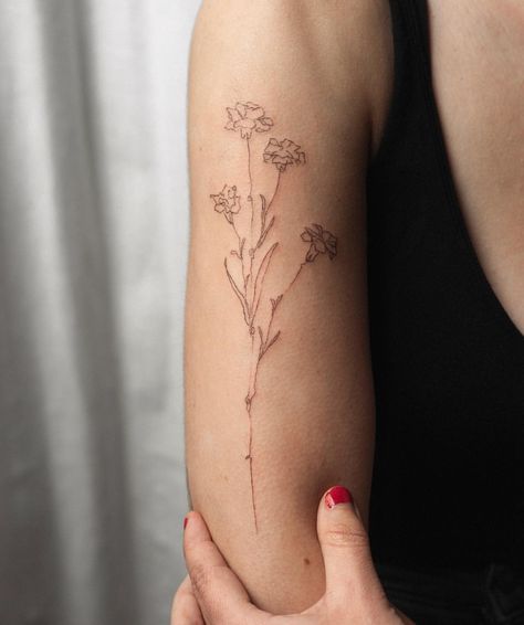 Handpoke Flower Tattoo, Brown Tattoos, Tiny Tattoo Placement, Abstract Flower Tattoos, Brown Tattoo Ink, Marigold Tattoo, Carnation Tattoo, Browning Tattoo, Small Finger Tattoos