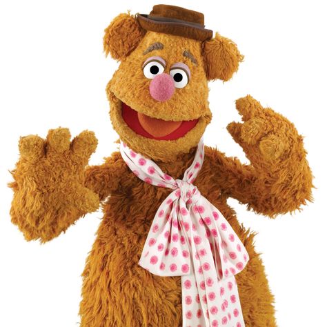 Fozzie Bear is a Muppet bear comedian. He is the best friend of Kermit the Frog. Throughout the Muppet Show, Fozzie was known to have told jokes and punctuate them with his catchphrase "Wocka wocka wocka!" only to have them heckled by his mother's old friends Statler and Waldorf. He is also the son of Emily Bear and Mr. Bear. Even in his young days, Fozzie wanted to be a comedian. On frequent occasions, Fozzie teamed with Rowlf the Dog. During the first season of the Muppet Show, Fozzie's... Voice Impressions, The Muppets Characters, Muppet Characters, Muppets Characters, The Muppet Movie, Statler And Waldorf, Muppets Most Wanted, Fozzie Bear, 3 Tv