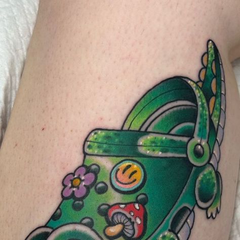 Brooklyn Bee Tattoo on Instagram: "I’ll wear crocs when they come out with croc crocs 🐊💖✨ . Made @fable.tattoo 🌈💖✨ Made with @chromatattooink 🌱💖✨ @thesolidink 🌱✨💖 . . . . . . . #crocs #crocodile #puns #bubblegumtrad #shoeaddict #brisbanetattoo #brisbanetattooartist #brisbanecity #brisbanetattooist #brisbanetattoos #traditionaltattoo #neotraditionaltattoo #cutetattoo #tattoo #ladytattooers #silly" Crocodile Wearing Crocs, Croc Shoe Tattoo, Croc Tattoos Shoe, Croc Tattoo, Fable Tattoo, Brisbane Tattoo, Shoe Tattoos, Bee Tattoo, Crocs Shoes