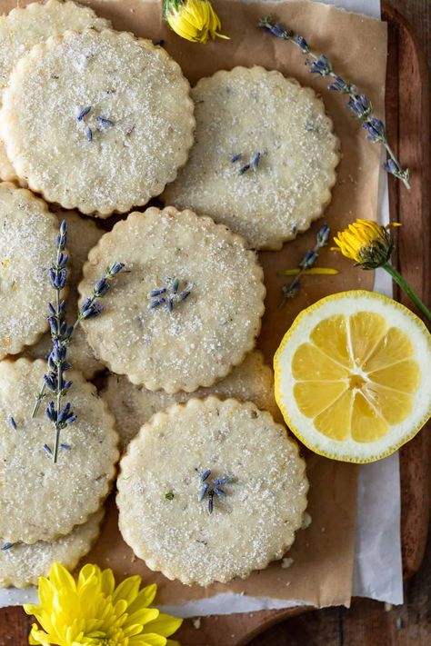 Brighten your day with the best lemon lavender shortbread cookies, an elegant twist on a timeless favorite. With the perfect blend of zesty citrus and soothing floral notes, these delicate, buttery cookies are guaranteed to bring a touch of sunshine to any spring or summer gathering. These lemon shortbread cookies with lavender are the perfect spring dessert idea to impress for Mothers Day, Easter, Bridal Showers, Baby Showers, or Tea Parties. You’ll fall in love with baking with lavender and Lavender Cookies Recipe, Cottage Core Baking, Lemon Lavender Cookies, Lavender Shortbread Cookies, Floral Food, Homemade Shortbread, Lavender Shortbread, Lavender Cookies, Lemon Shortbread