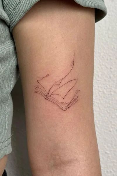 Becoming Tattoo Ideas, Book Tattoo Small Simple, A Reader Lives A Thousand Lives Tattoo, Dainty Bookish Tattoos, Dinky Tattoos, Turn The Page Tattoo, Mini Book Tattoos, Gardening Tattoo Ideas, Open Book Tattoo Ideas