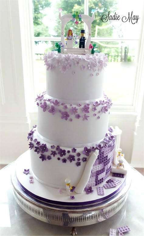 minus the extra Lego stuff at the bottom; I like how they used flowers similar to the Lego flowers. Wedding Lego Ideas, Lego Wedding Ideas, Lego Wedding Topper, Purple Lego Flowers, Lego Bride And Groom, Wedding Cake With Lego Topper, Wedding Cakes Purple, Lego Wedding Cake, Lego Wedding Cakes